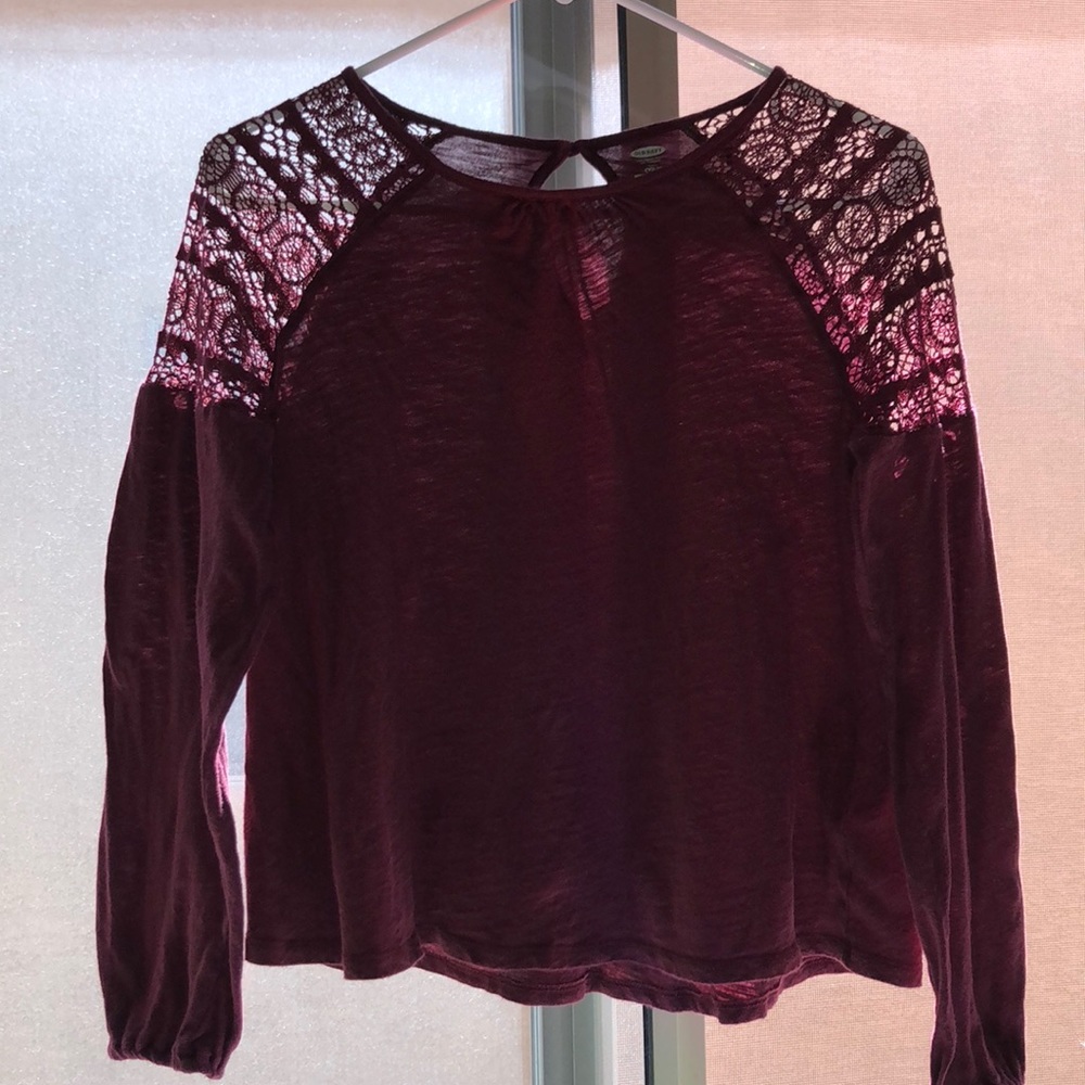 A long sleeve maroon top